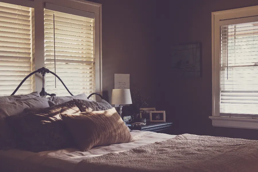 Sample image: Faux-wood blinds in a bedroom